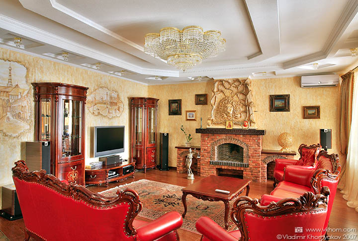 The living room in golden and red colors